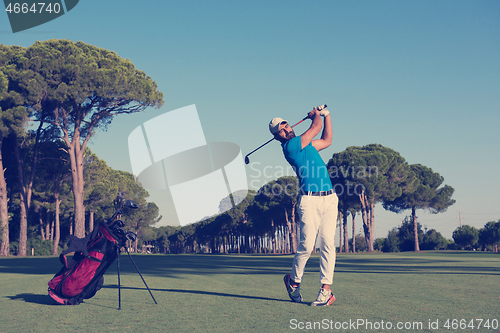 Image of golf player hitting long shot