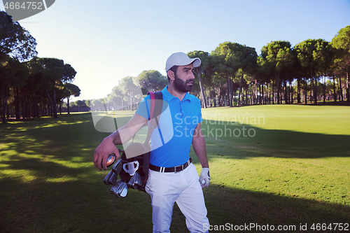 Image of golf player walking