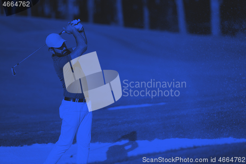 Image of golfer hitting a sand bunker shot