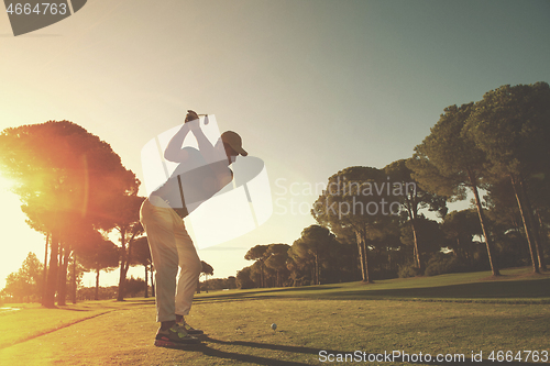 Image of golf player hitting shot with club