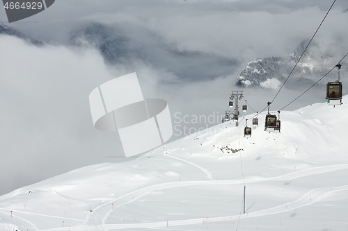 Image of Ski lift cabin in snowy mountain landscape