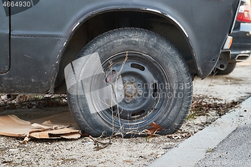 Image of Flat Tire on abandoned wreck