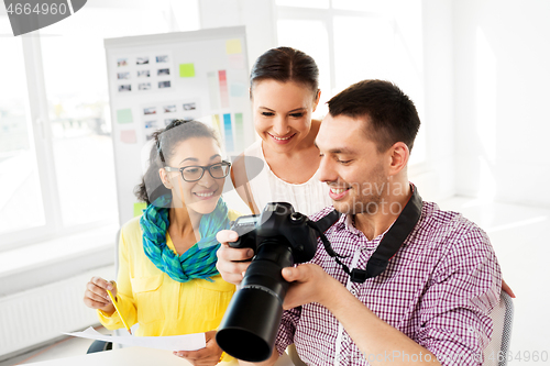 Image of photographers with camera at photo studio