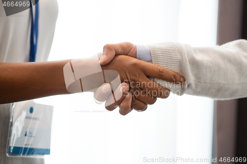 Image of handshake of people at business conference