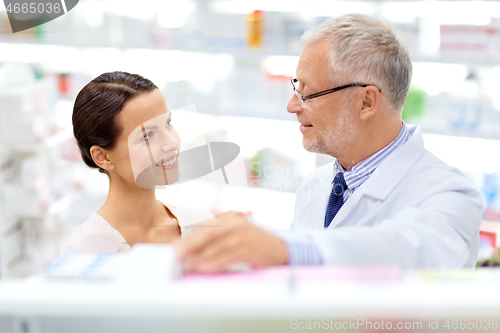 Image of apothecary and woman with drug at pharmacy