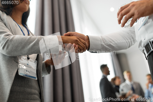 Image of handshake of people at business conference