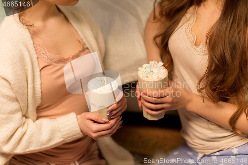 Image of two women drinking hot chocolate with marshmallow