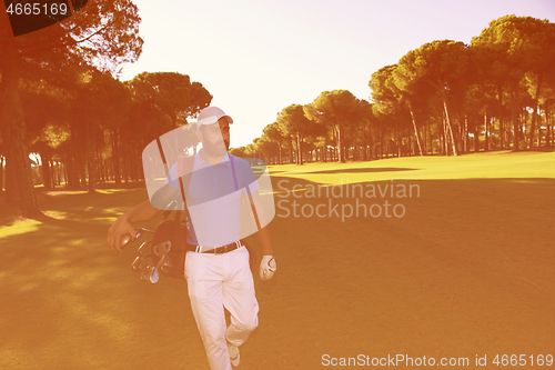 Image of golf player walking