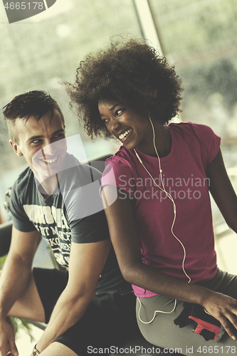 Image of couple in a gym have break