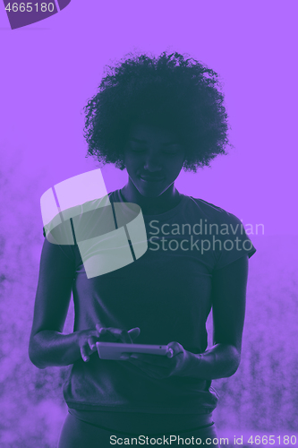 Image of african american woman using tablet