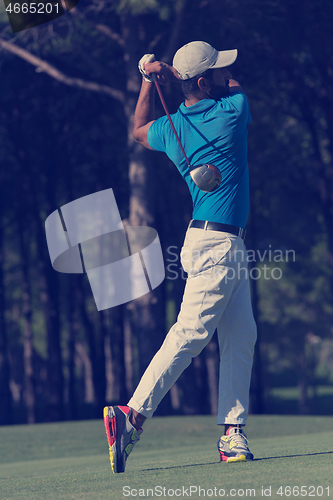 Image of golf player hitting long shot