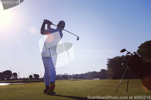 Image of golf player hitting long shot