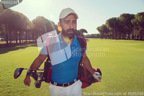 Image of golf player walking