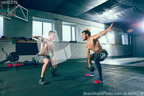 Image of Athletic man doing exercise for arms.