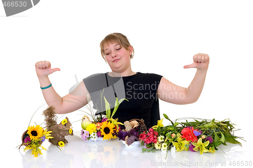 Image of Young girl arranging flowers 
