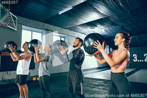 Image of functional fitness workout at the gym with medicine ball