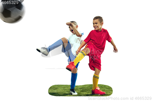 Image of Young boys kicks the soccer ball