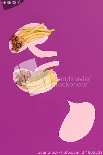 Image of I love fast food. French fries in the form of is kidneys isolated on pink background