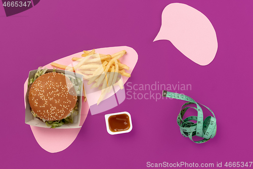 Image of I love fast food. French fries in the form of is liver isolated on pink background