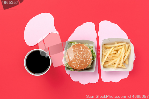 Image of I love fast food. French fries in the form of brain isolated on red background