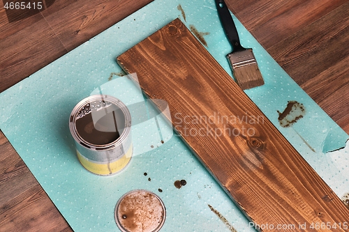 Image of Painting wood lumber plank