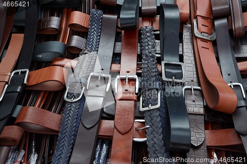 Image of Leather belts at a market