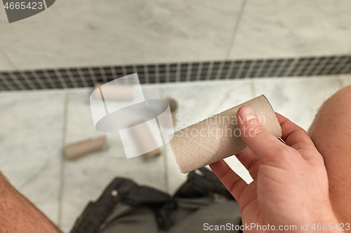 Image of Finding empty roll in the restroom