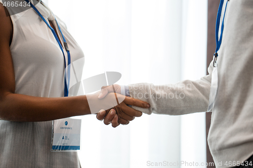 Image of handshake of people at business conference