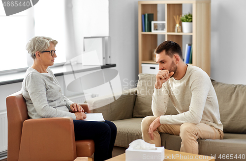 Image of senior woman psychologist and sad man patient