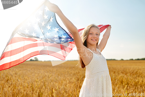 Image of girl with american flag waving over cereal field