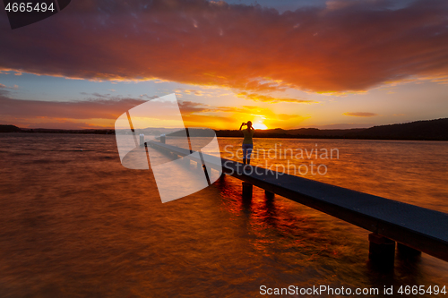 Image of Taking photos of amazing sunsets from the jetty