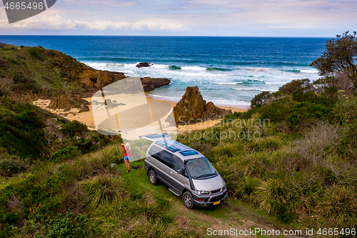 Image of Female on road trip vacation holiday by ocean