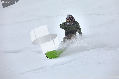 Image of Snowboarding in fresh powder snow