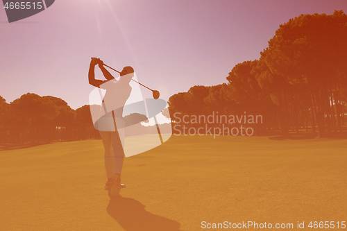 Image of golf player hitting long shot