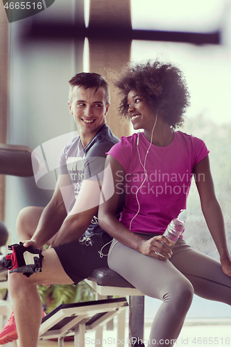 Image of couple in a gym have break