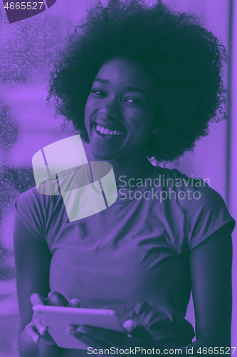 Image of african american woman using tablet