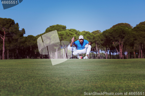 Image of golf player aiming perfect  shot