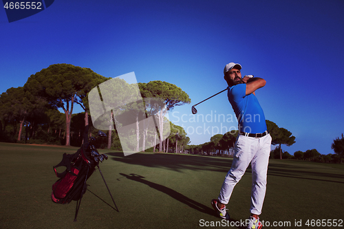 Image of golf player hitting long shot