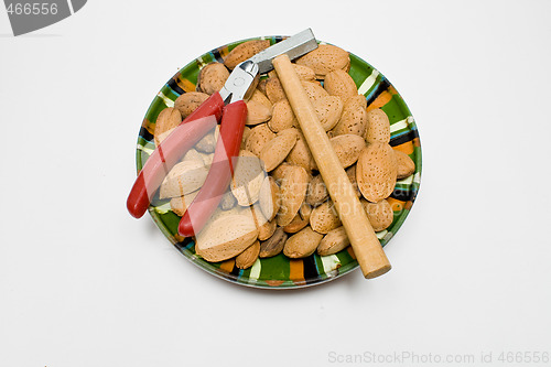 Image of plate wit almond seeds and tools