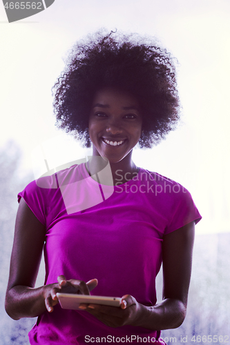 Image of african american woman using tablet