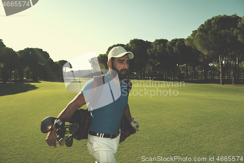 Image of golf player walking