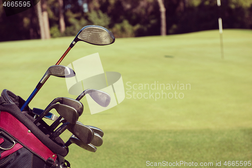 Image of close up golf bag on course