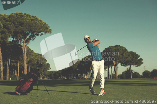 Image of golf player hitting long shot