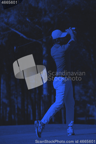 Image of golf player hitting long shot