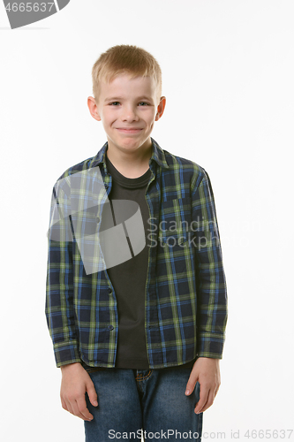 Image of Portrait of a laughing young man of ten years on a white background