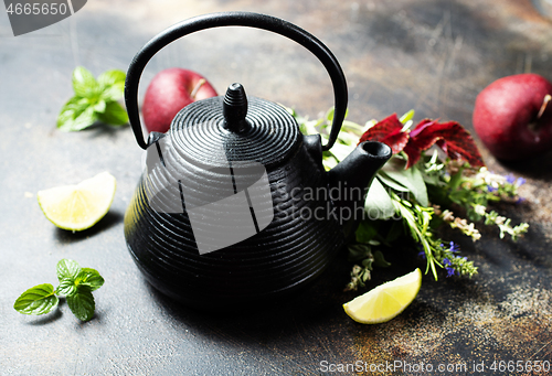 Image of teapot and herb