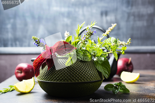 Image of teapot and herb