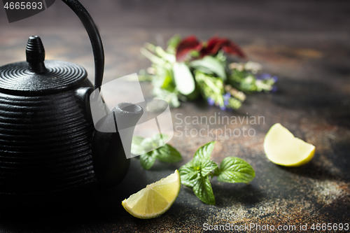 Image of teapot and herb