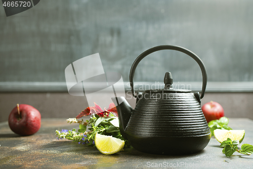 Image of teapot and herb