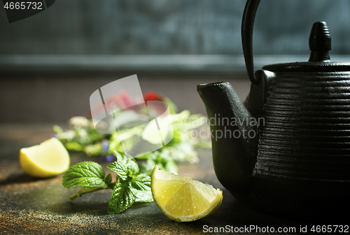Image of teapot and herb